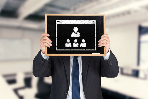 Businessman showing board against classroom