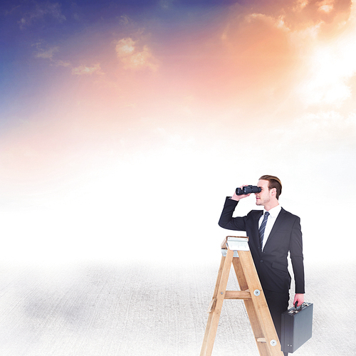 Businessman looking on a ladder against blue and orange sky