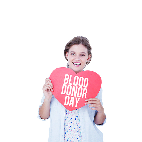 Woman holding heart card  against blood donor day