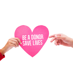 Woman passing man pink heart against be a donor save lives