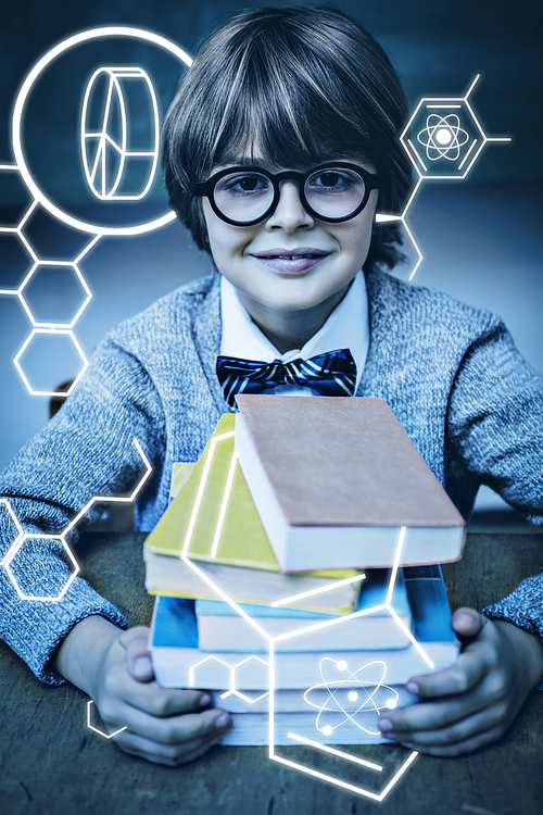 Science graphic against boy with stack of books in classroom