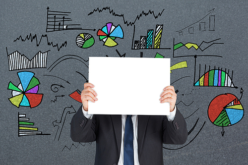 Mature businessman showing card against grey background