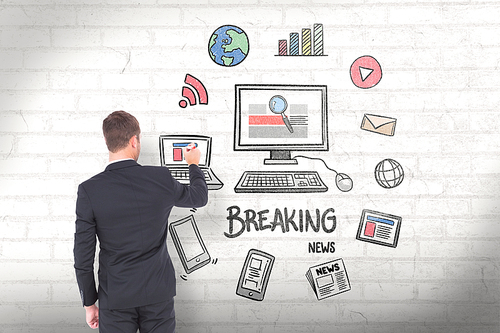 Business man writing with chalk against white wall