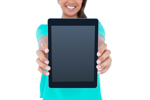 Casual brunette showing tablet computer on white background