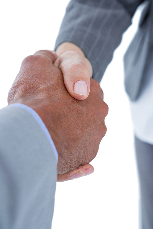 Businessman shaking hands with a co worker on white background