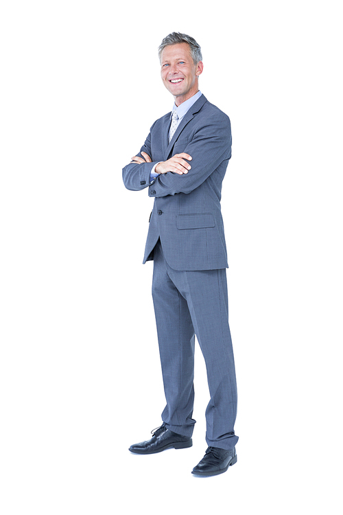 Businessman with arms crossed against a white background