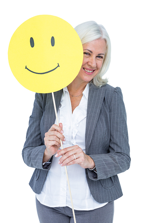 Businesswoman holding happy smiley face on white background