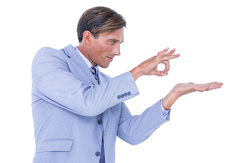 Businessman walking while gesturing with hands on a white background