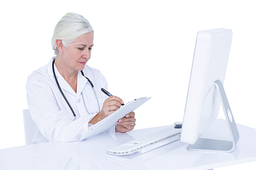 Doctor working on her computer on a white screen