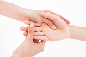 Physiotherapist doing hand massage in medical office