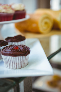 Muffins in a bakery on a sunny day