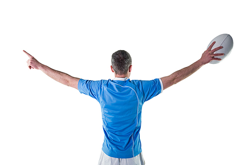 Rugby player gesturing with hands and holding a rugby ball