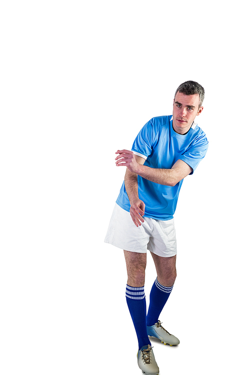 Portrait of a rugby player throwing a rugby ball