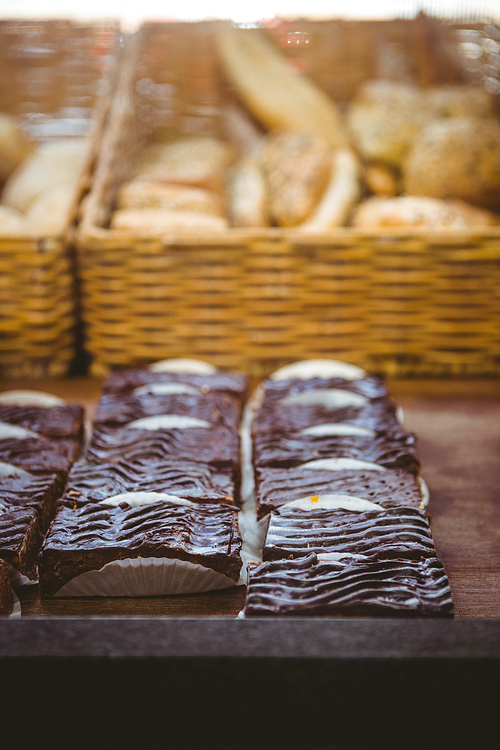 Close up of basket with fresh bread and pastry at the bakery