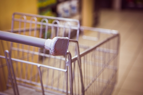 Trolley with product on shelf in supermarket