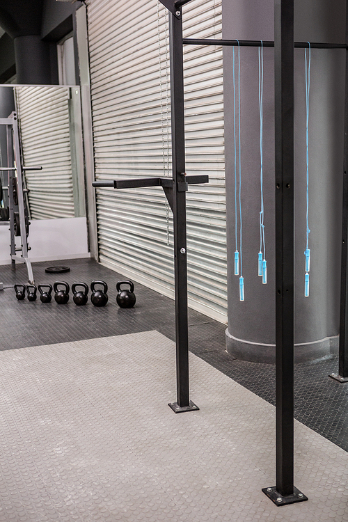 Empty crossfit gym with skipping ropes and kettlebells