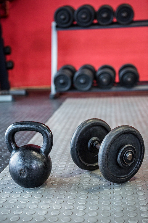 Kettlebell next to dumbbells  in crossfit gym