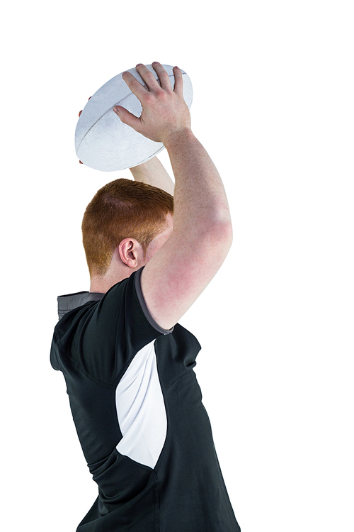 Side view of a rugby player about to throw a rugby ball