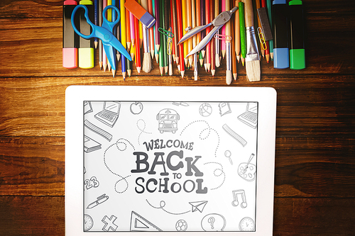 back to school against students desk with tablet pc