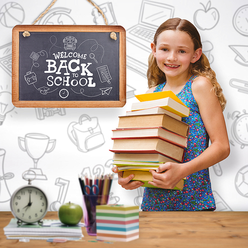 Cute little girl carrying books in library against bleached wooden planks background