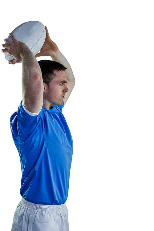 Side view of a rugby player about to throw a rugby ball