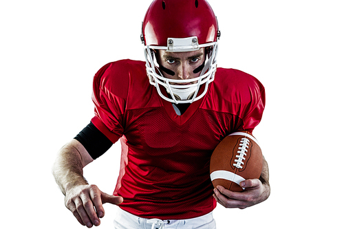 Portrait of focused american football player being ready to attack against white background