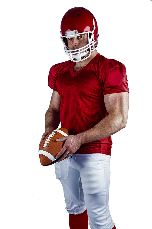 American football player holding ball on white background
