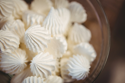 Close up view of meringues in a bowl at coffee shop