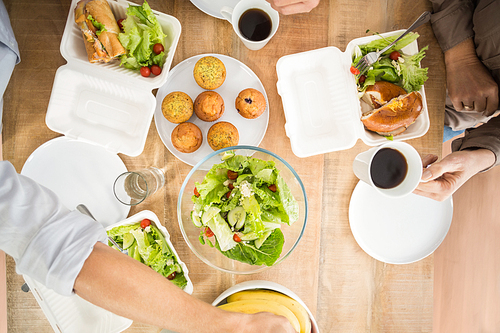 Upward view of business people having lunch together