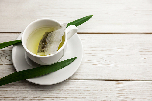 Cup of herbal tea on table shot in studio