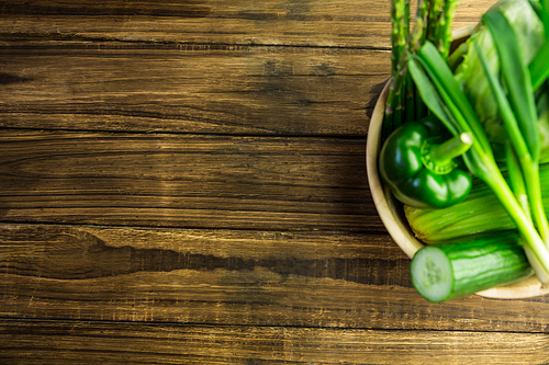 Green vegetables in bowl shot in studio