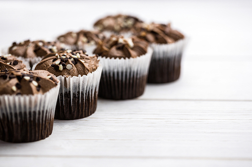 Chocolate cupcakes on a table shot in studio