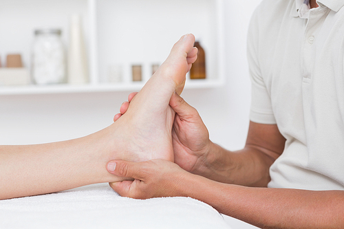 Woman having foot massage in medical center