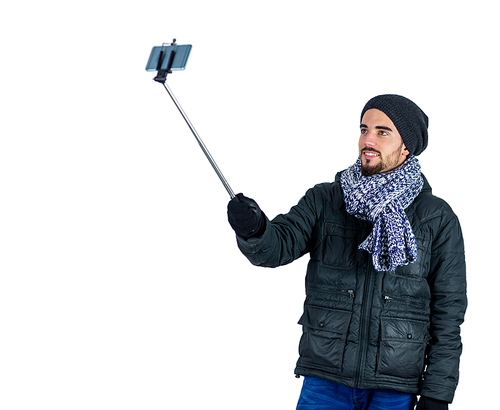 Bearded man taking a selfie shot in studio