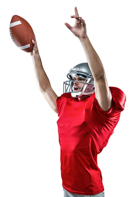 American football player holding ball while pointing up against white background