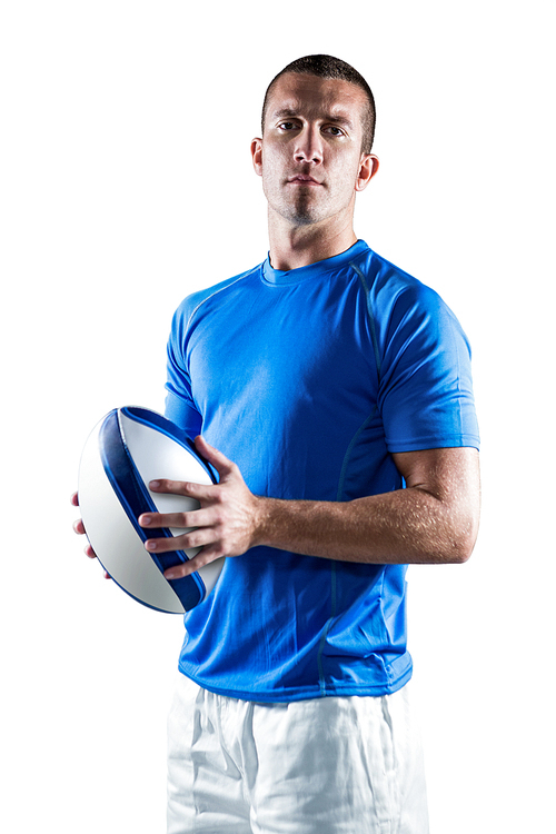 Portrait of confident rugby player holding ball against white background