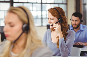 Man and women working in bright office