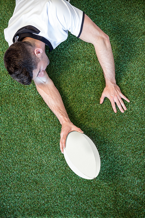 High angle view of man holding rugby ball
