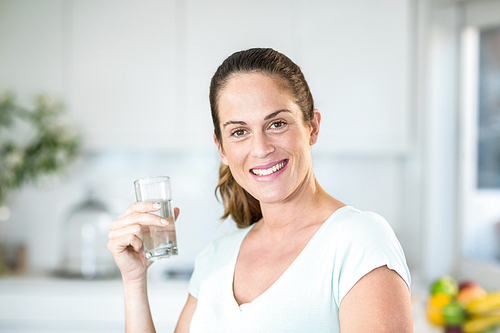 Portrait of happy woman holding water