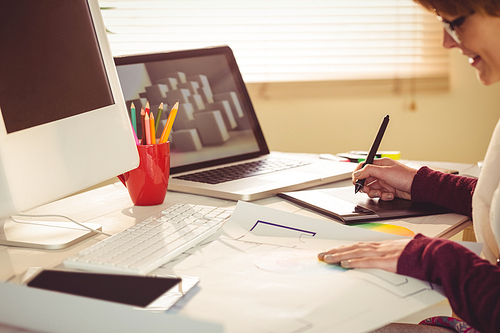 Graphic designer working at desk