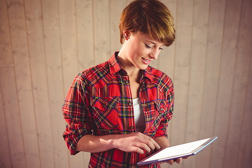 Pretty young woman using tablet