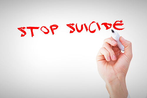 Stop suicide against businessmans hand writing with marker