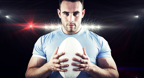 Composite image of rugby player  with ball