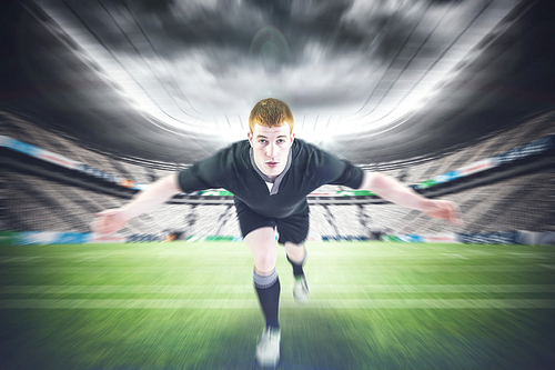 Composite image of rugby player tackling the opponent