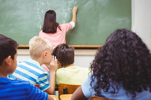 Student whispering into another students ear at the elementary school