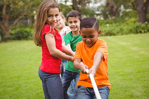 Kids pulling a large rope together