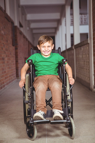 Smiling student in a wheelchair on elementary school campus