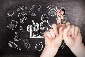 Fingers posed as students against black background