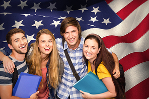 Students holding folders at college corridor against digitally generated american national flag