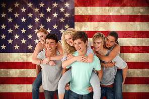 Teenagers giving their friends piggyback rides against usa flag in grunge effect